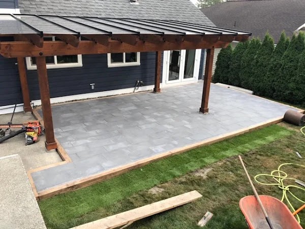 Paving stone patio with cedar pergola built by Nile Landscaper in Winnipeg